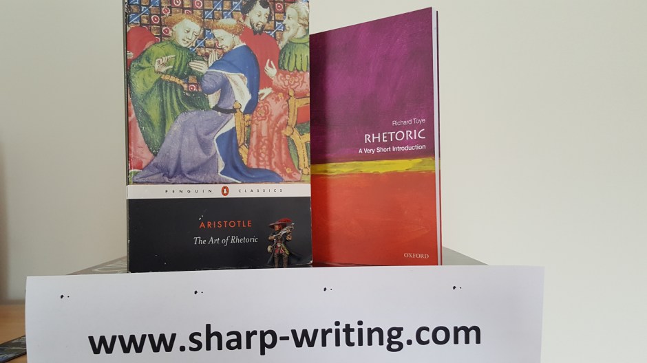 The Rhetoric by Aristotle, and intro to Rhetoric and a descent miniature being used as proxy for porthos
